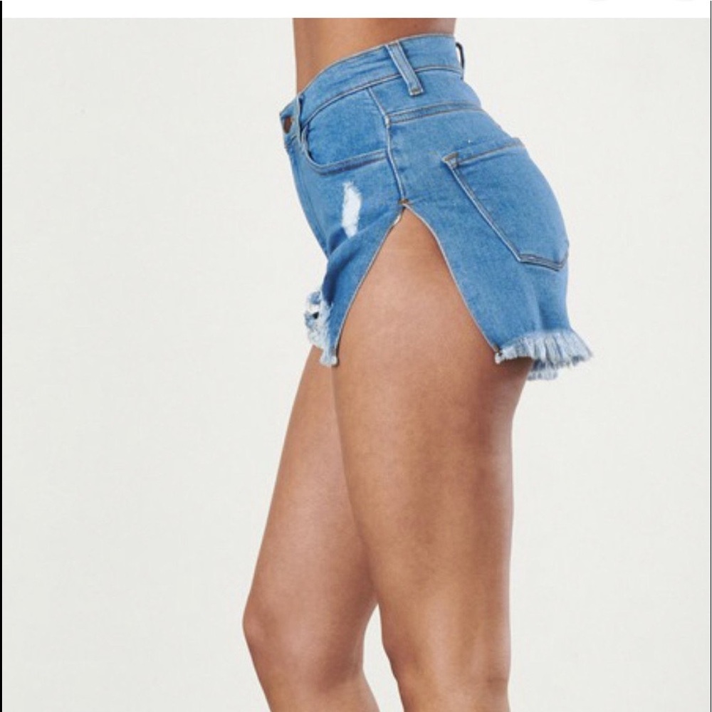 Side slit distressed denim shorts